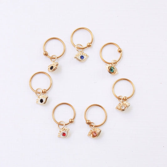 PIERCING OJO CON PESTAÑAS COLORES ORO